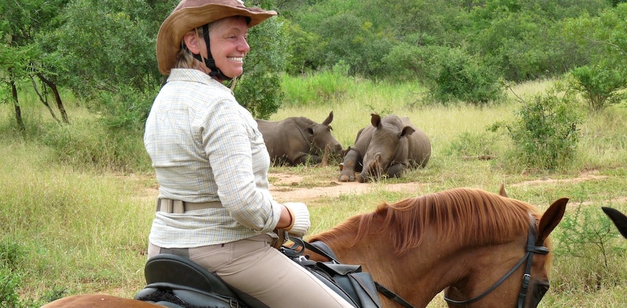 Rhinos on horseback trail at Wait-a-Little